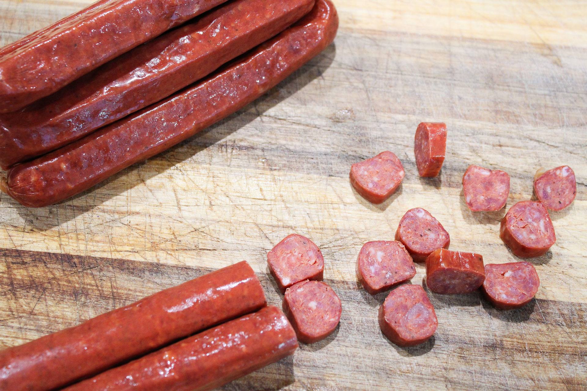Amaral's Linguica Sausage being cut on a cutting board