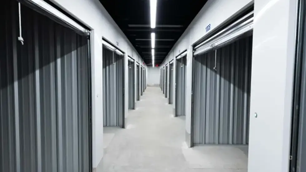 Interior corridor of a high-end self-storage facility with climate-controlled units and clean, modern design.
