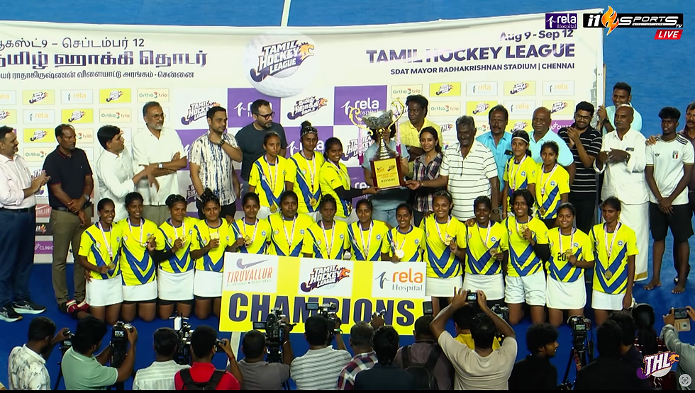 Women’s hockey team in yellow jerseys celebrates with trophy and CHAMPIONS sign at Tamil Hockey League awards ceremony, Chennai