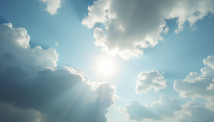 High angle view of partly cloudy sky with sun breaking through