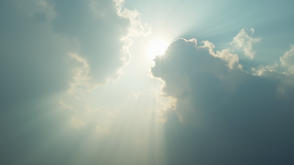 Eye-level view of a cloudy sky with hints of sunlight