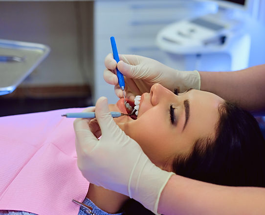 close-up-image-dentist-examining-female-s-teeth-dentistry.jpg