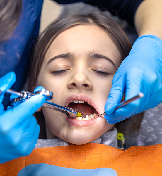 girl-dentists-office-dentist-examining-child-patients-teeth-dentistry-concept (1).jpg