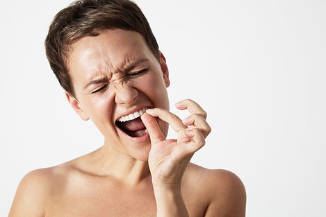 woman-touching-tooth.jpg