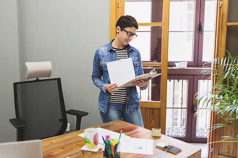 businesswoman-reviewing-some-documents.jpg