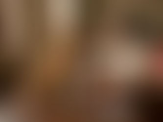 Woman training a golden retriever at home