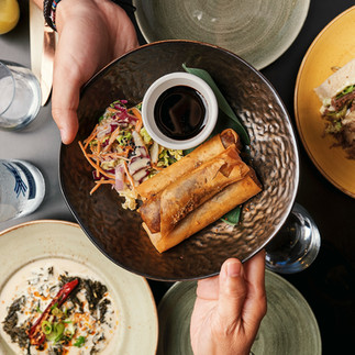 Kasa and Kin Filipino restaurant Soho London crispy lumpia spring rolls with dipping sauce and fresh garnish