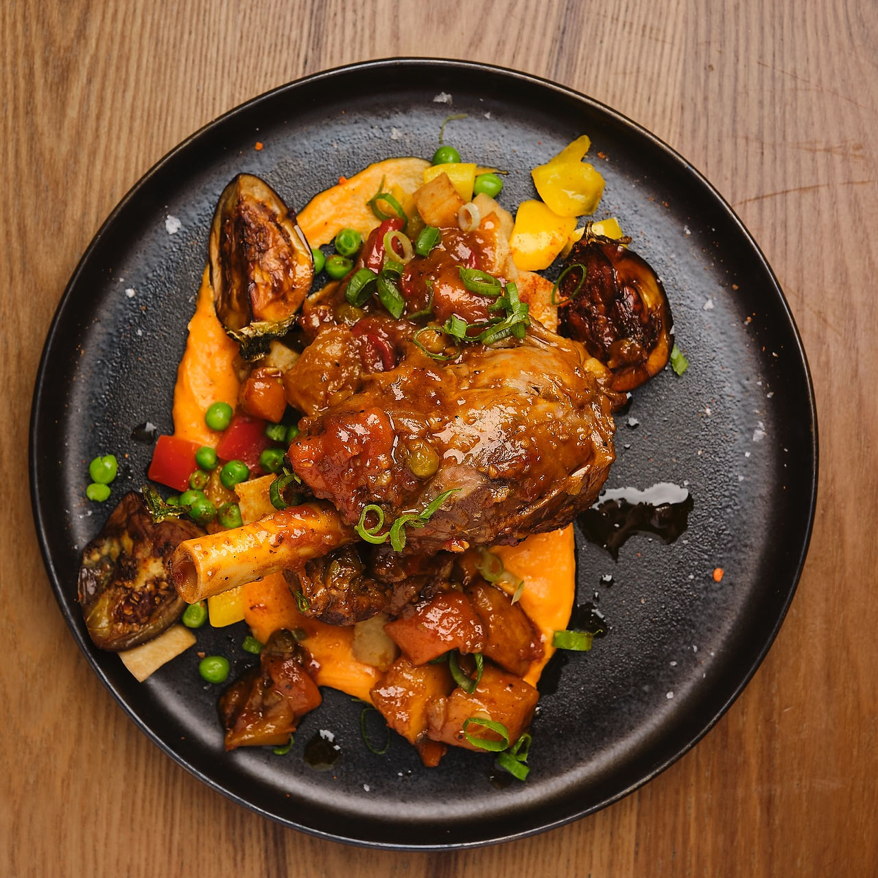 Kasa and Kin Filipino restaurant Soho London signature Filipino main dish with roasted meat, vegetables, and puree