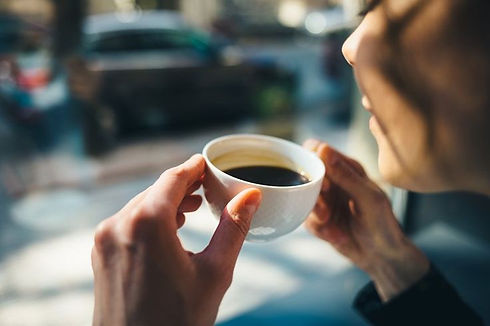 Young woman drinking her coffee.jpg