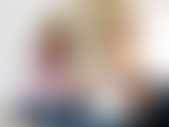 Woman looking down in thought with therapist