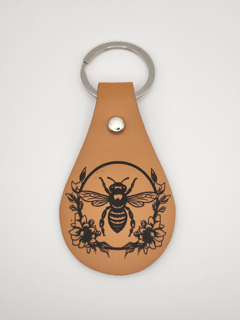 Leather keychain with bee and floral design