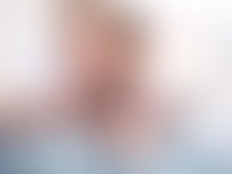 man with neck pain holding his neck