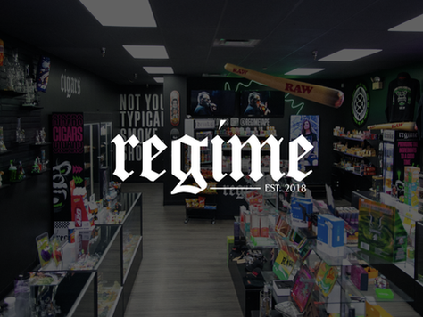 A wide-angle view of the inside of Regime smoke shop, featuring shelves with products, colorful signage, and a neon aesthetic.