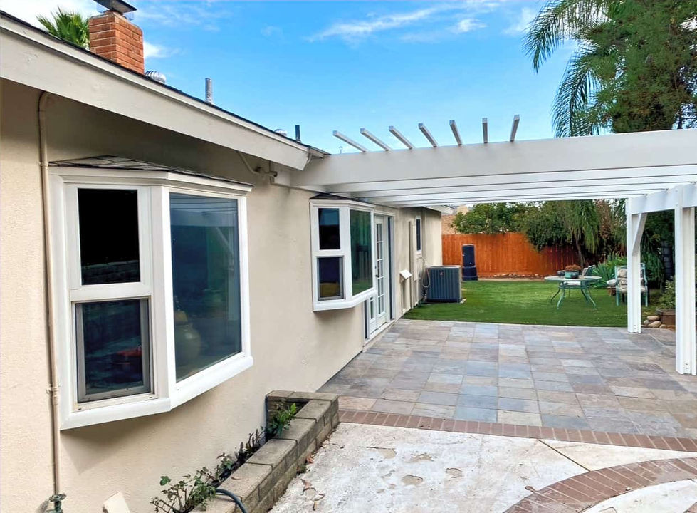 Professional exterior paint job in progress in Poway, with masking, prep work, and surface protection applied by VB Painting Services.