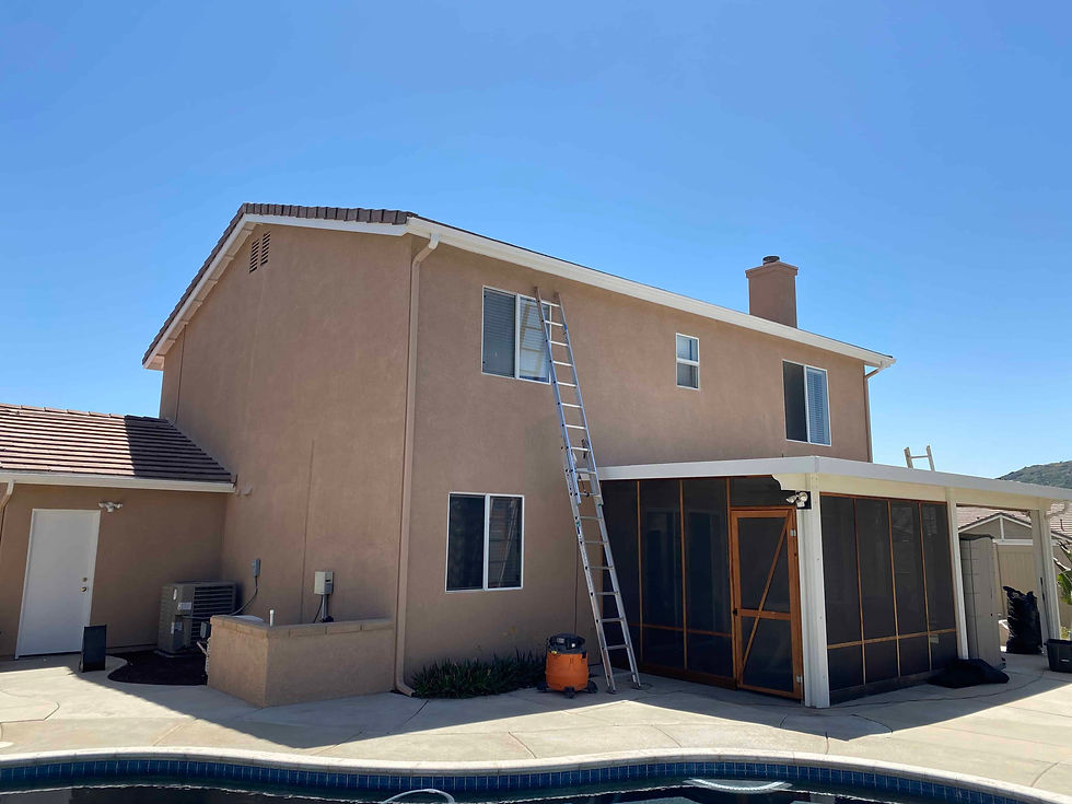 Two-story Wildomar home with a bold new exterior color scheme painted by VB Painting Services in Temecula, showcasing professional weather-resistant finish.