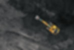 Coal mining in an open pit. Mining excavator loads coal in haul truck in quarry. Excavator