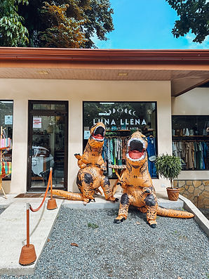 Dinosaurs disguises in front of the Luna Llena store in Manuel Antonio
