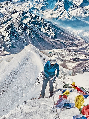 Everest One climber climbing to the summit of Lobuche East in Nepal