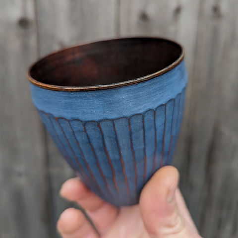 Wooden cup with blue milk paint