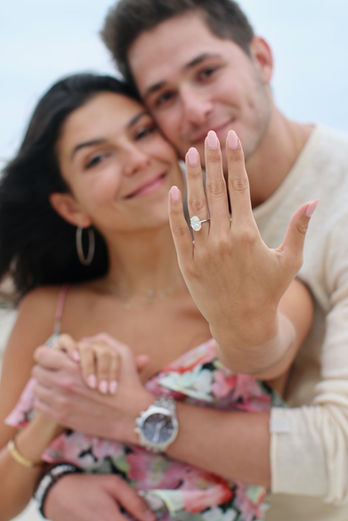 Couple embracing and crying tears of joy immediately after a surprise marriage proposal captured documentary style