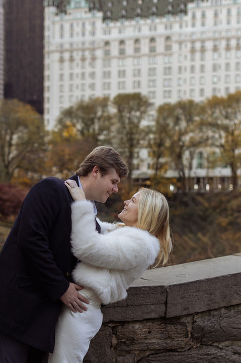 Two people sharing a genuine moment of connection during an unposed luxury engagement session outdoors