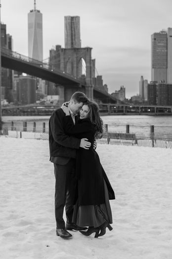 Candid photo of a surprise marriage proposal captured by a documentary wedding photographer in a natural outdoor setting