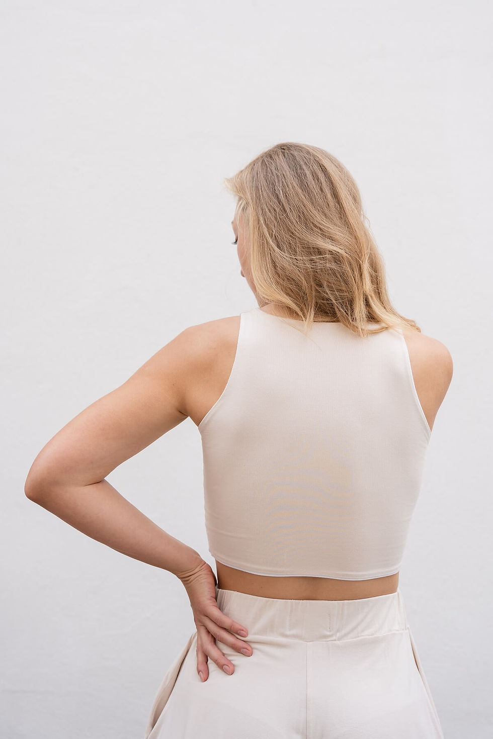 Thumbnail: Soft white racer crop top with double-layered bamboo fabric and timeless silhouette