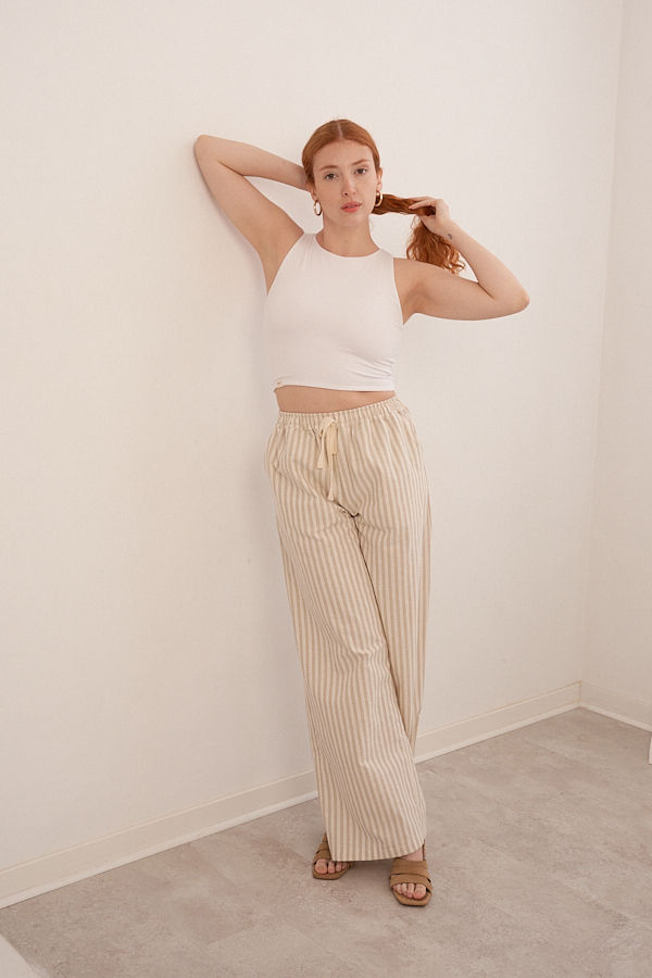 Thumbnail: Women’s breathable cotton palazzo trousers styled with minimalist racer tank top