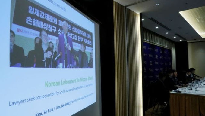 Japan may not attend summit in Korea due to wartime labour dispute .