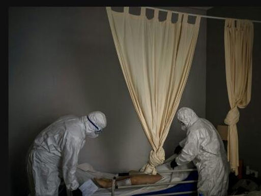 SPAIN'S MORTUARY WORKERS ENDURE THE DAILY MARCH OF DEATH