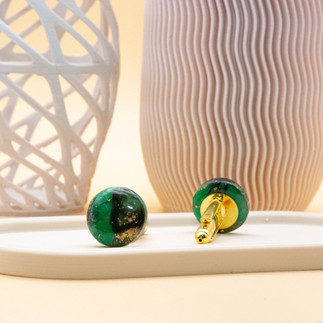 Elegant cufflinks featuring a mesmerizing Dragons Eye effect in marbled black, green, and gold, complemented by polished gold backers.