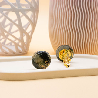 Elegant cufflinks featuring a mesmerizing Dragon's Eye effect in marbled black, green, and gold, complemented by polished gold backers.