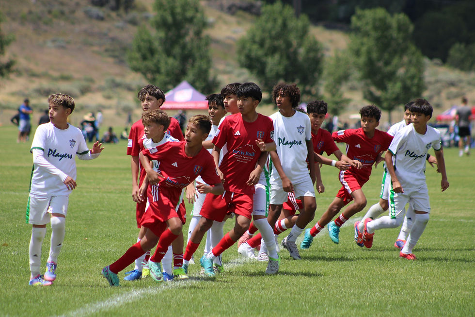 2012 Red going for a corner kick vs players at 18.JPG
