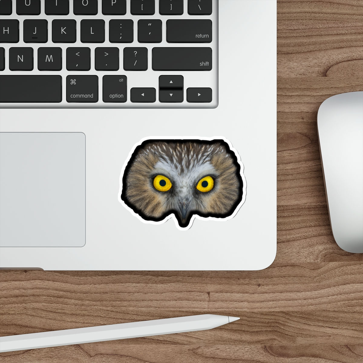 a large sticker of an owl face with yellow eyes on an object