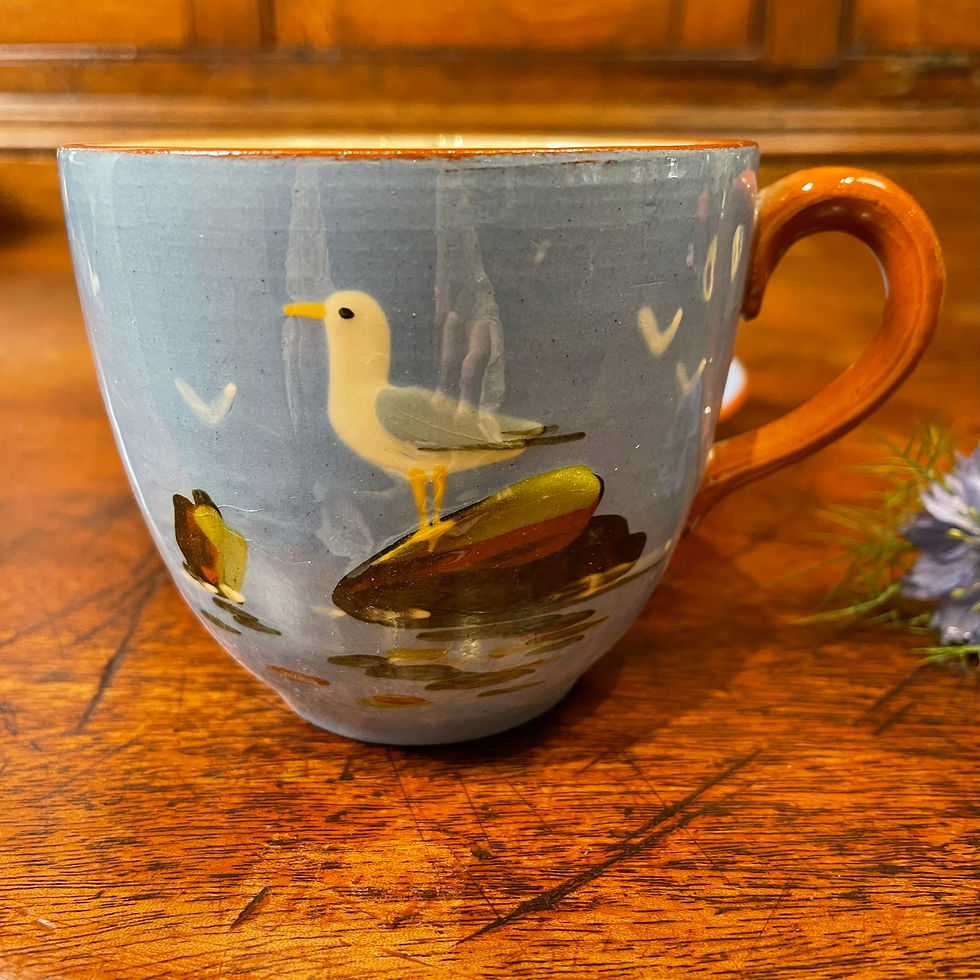 Thumbnail: A Dartmouth Potter Cup and Saucer