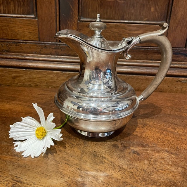 An Edwardian Silver Plated Coffee Pot