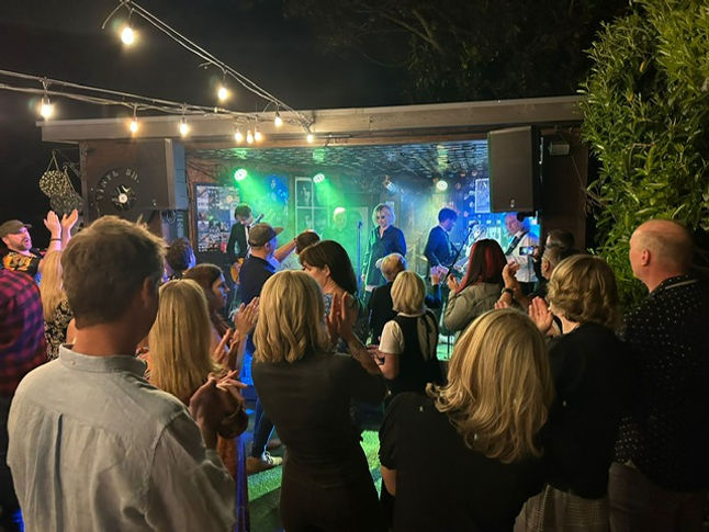 Parallel Blondes -the Blondie Band on stage at Wokingham garden festival with a crowd in front of them