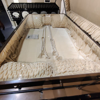 Casket covered in money on display at the National Funeral History Museum in Houston