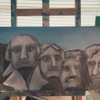 The Merry Men of Mount Rushmore with a touched-up sky.