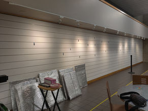 Art on the move! Art taken down from Midwest City Gallery wall. Moving to the art festival!