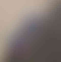 Paintings laid out for hanging.