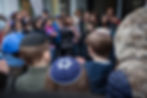 Jewish youth are gathering around a Stolpersteine memorial ceremony in Berlin, Germany