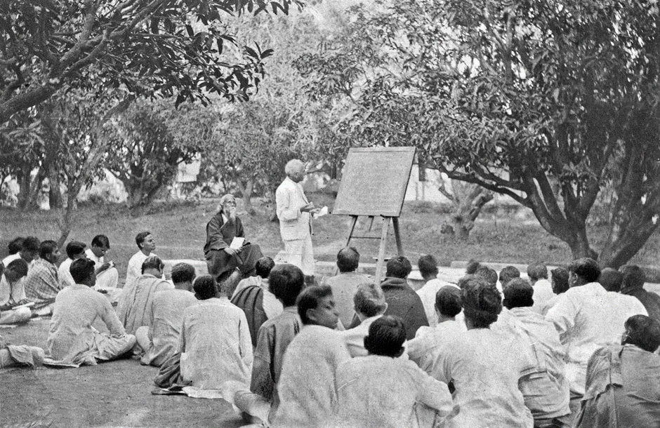 Figure 1: Teaching in the midst of Nature at Santiniketan. Rabindranath can be seen seated in this picture.