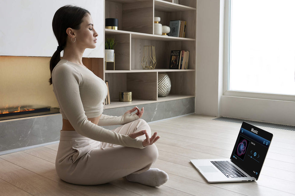 full-shot-woman-meditating-home-with-laptop.jpg