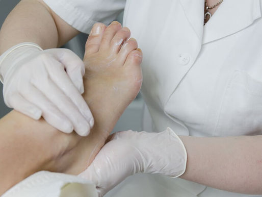 A foot care nurse is giving foot care service