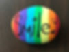 smiley rainbow painted rock