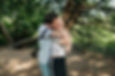 A dad making his teenage daughter laugh as he hugs her during their fun family photoshoot with Tara Gillen Photography