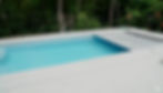 Outdoor pool with bright blue water, white deck, and forest backdrop. A treehouse is visible. Text reads "River Pools" in the corner.