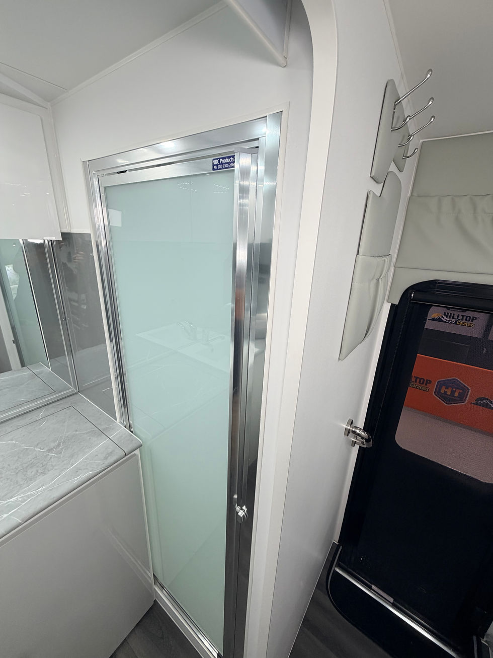 Thumbnail: Hilltop H18 caravan bathroom vanity and sink – modern touring caravan bathroom
