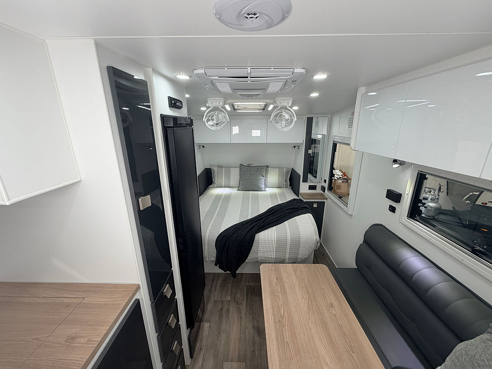 Thumbnail: Hilltop H15 Karijini caravan interior – long shot view to queen bed in compact off-road Australian-built caravan